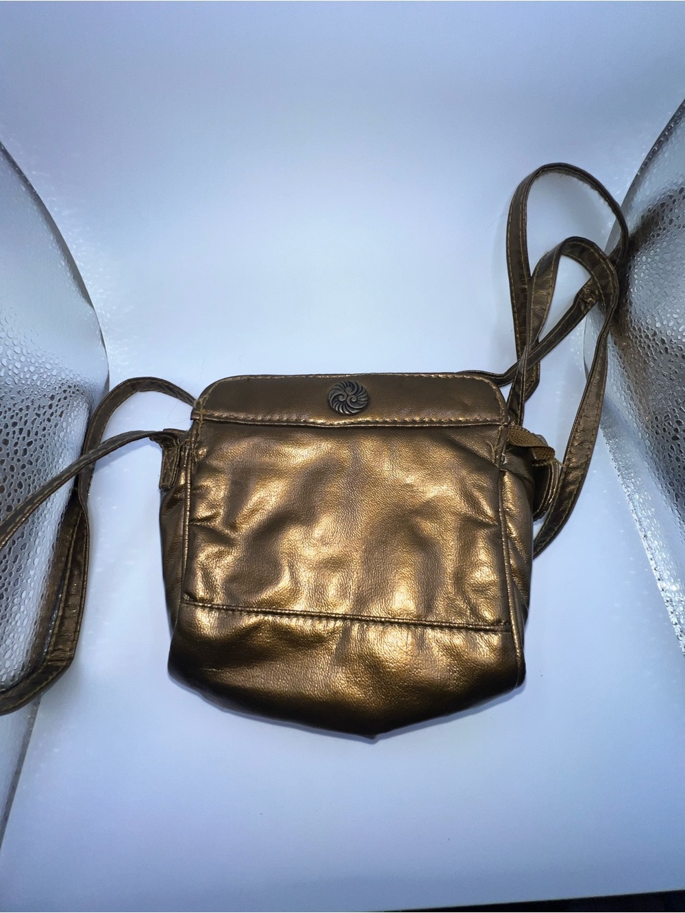 Vintage metallic bronze crossbody purse manufactured by the brand Beverly Hills